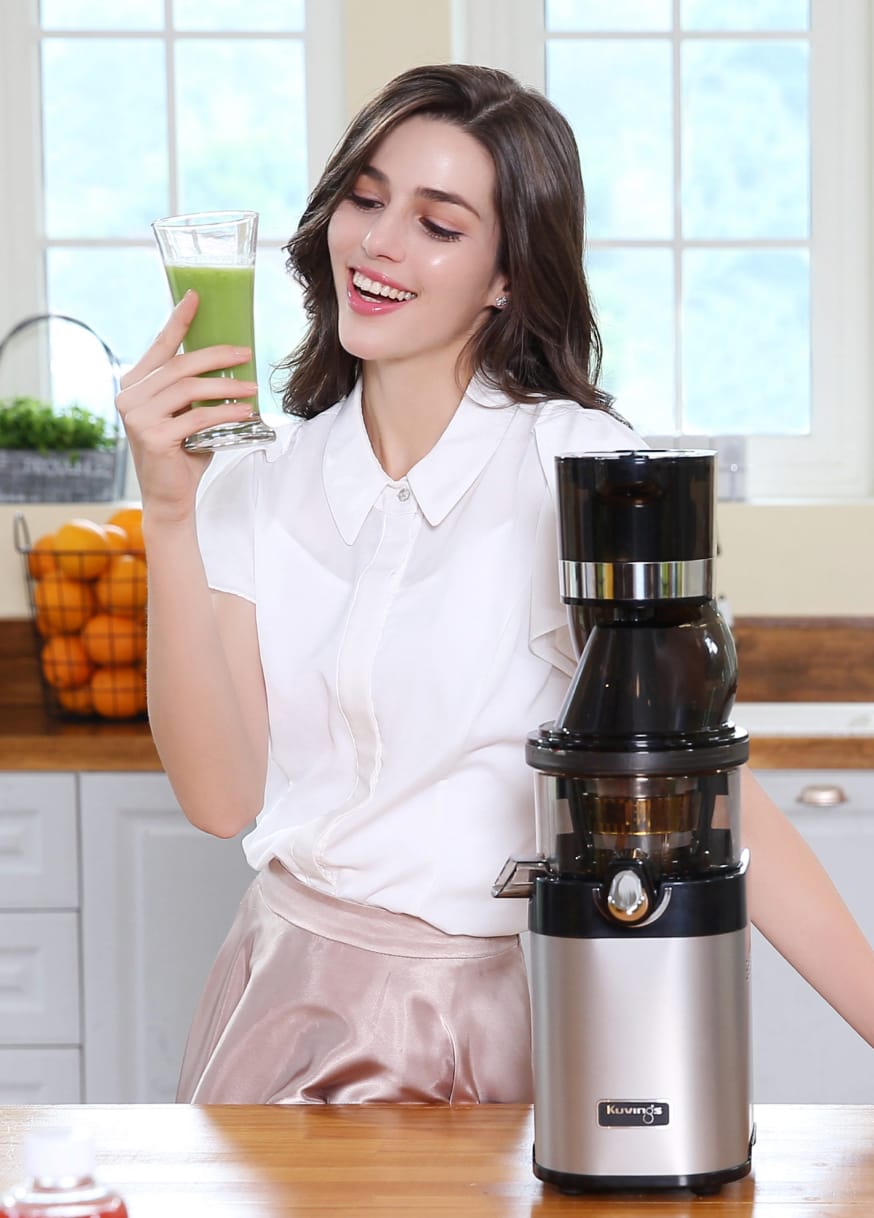 Woman using a juicer