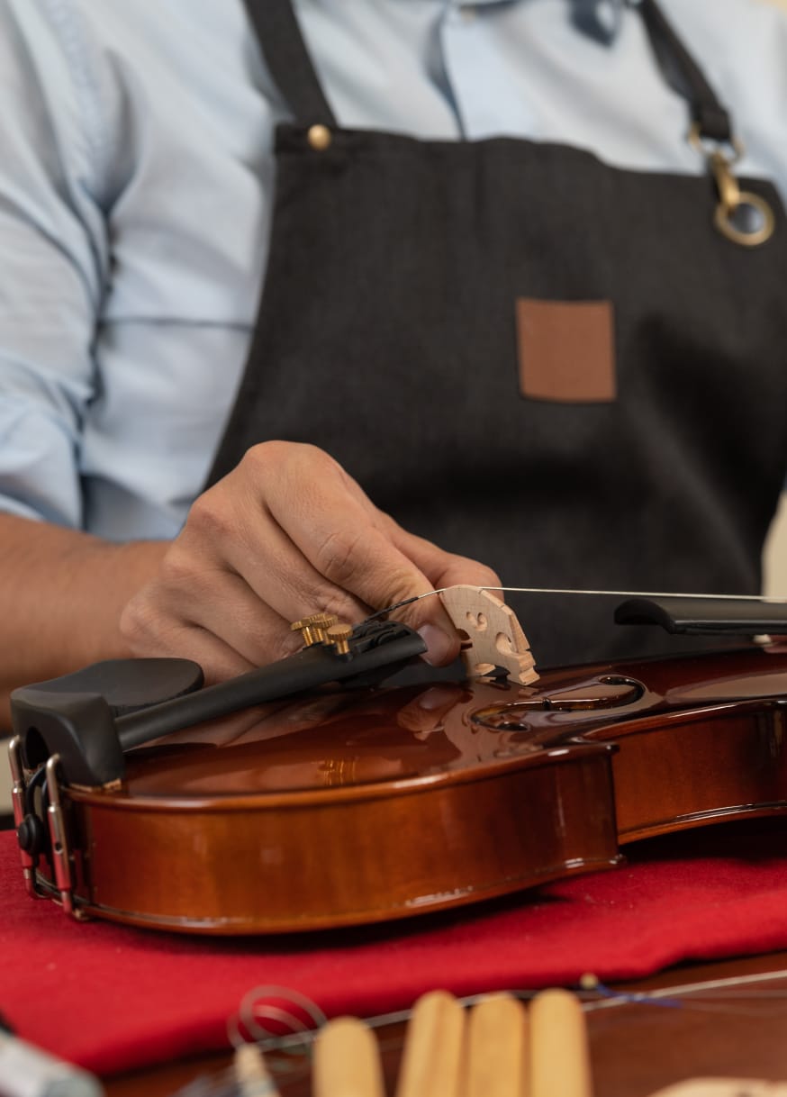 Man servicing a violin