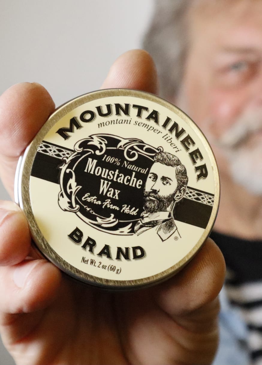 Man holding Mountaineer beard care product